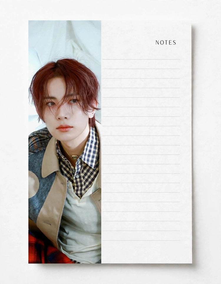 A vertical notepad with a printed portrait of a young man on the left half and lined writing space on the right half, labeled NOTES at the top right, shown on a light neutral background.