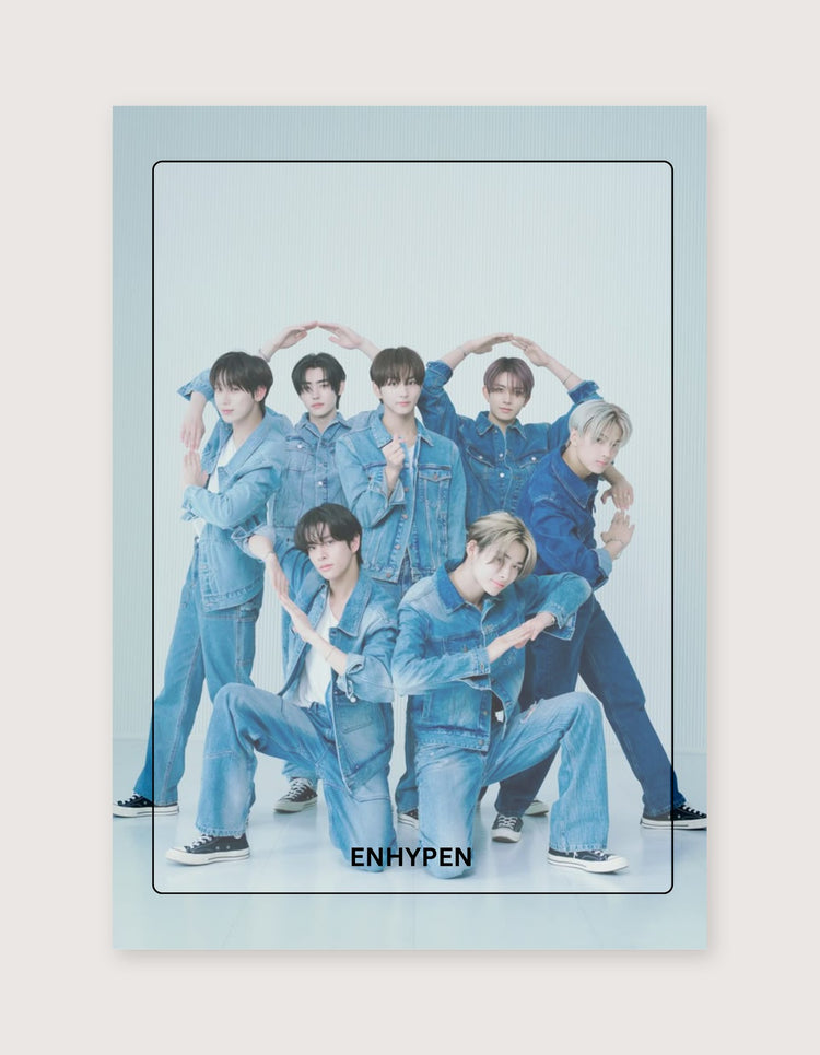 A vertical poster print featuring the K-pop group ENHYPEN in matching blue denim outfits, posed together against a pale studio background. The poster has a light blue border and the word 'ENHYPEN' printed at the bottom.