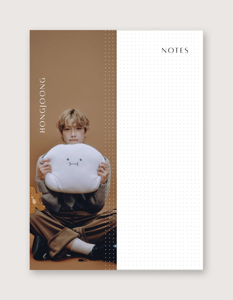 A vertical notebook or planner page design with a warm brown left panel showing a seated person holding a white plush cushion, and a white right panel with dotted grid lines and the word NOTES at the top.