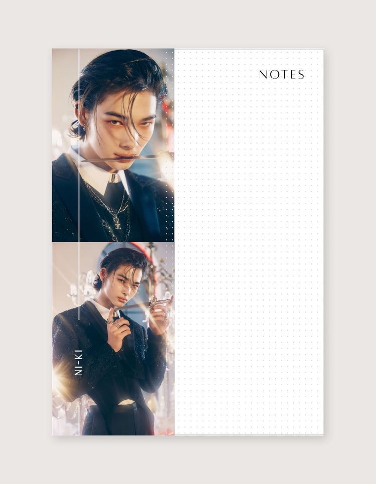 A vertical notebook or planner page with a white dotted grid right side and two portrait photos of a man in dark clothing on the left side. The word NOTES appears at the top right.