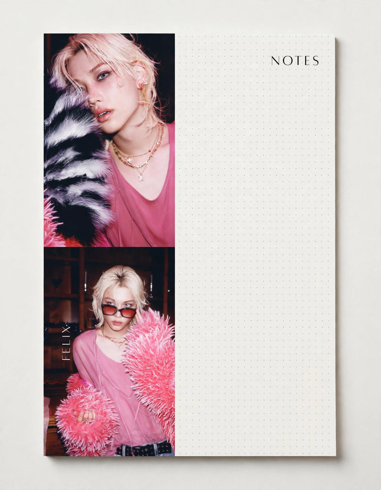 A white grid notepad with the word NOTES printed in the top right corner, shown on a light neutral background. The left side of the notepad features two vertical printed portrait photos of a blonde woman wearing a pink top and a fluffy black-and-white fur collar in the top photo, and a pink fluffy collar in the bottom photo.