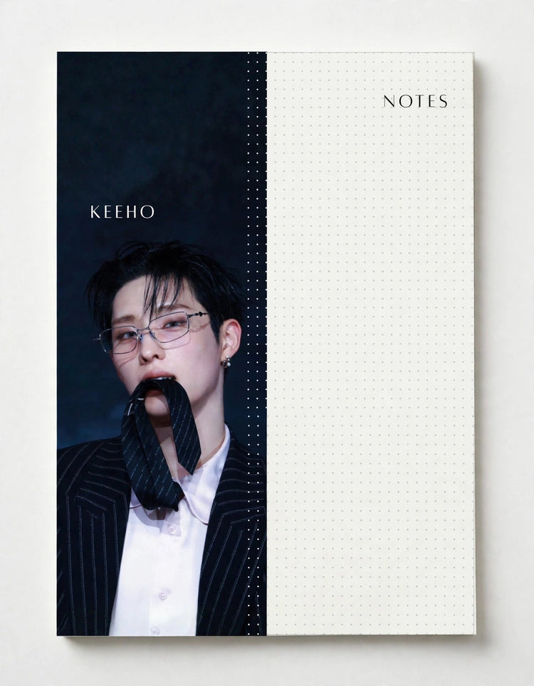 A notebook or planner cover design with a split layout: the left side shows a dark portrait photo of a man in a pinstripe suit with the name 'KEEHO' printed on it, and the right side is a white dotted grid area labeled 'NOTES'.